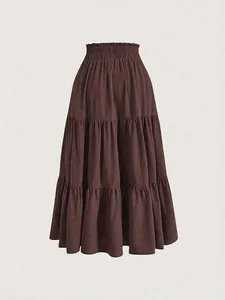 Detailed view of the layered texture and elastic waist of this plus-size brown tiered skirt.