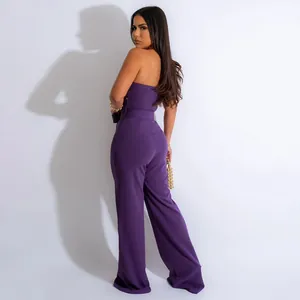 Elegant purple strapless jumpsuit with wide-leg pants showing slim fit silhouette