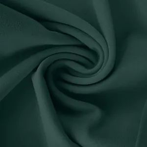Close-up of forest green textured fabric material for women's office yoga pants