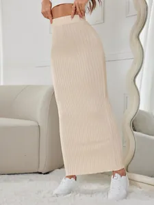 Detailed view of beige rib-knit maxi skirt with comfortable elastic high waist