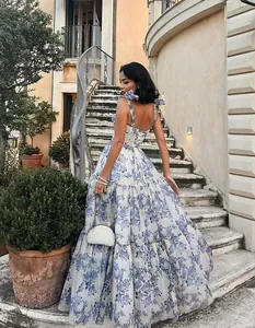 Elegant floral organza maxi dress with tiered skirt for wedding guests and evening parties.