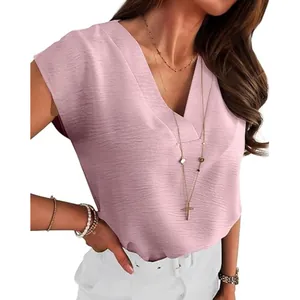 Close-up detail of elegant pink V-neck sleeveless top with textured fabric for women