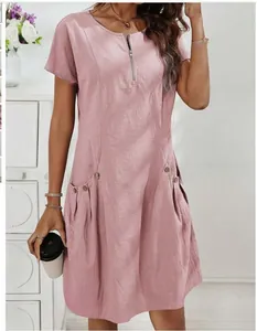 Summer short-sleeved cotton linen dress with zipper neckline and pocket details in pink.