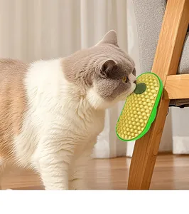 Close-up of a cat interacting with avocado self-groomer featuring an integrated catnip ball