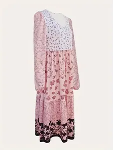 Close-up detail of long-sleeve floral print maxi dress with elegant crew neck design