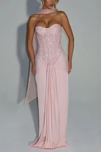Elegant pink sequin strapless maxi dress with draped wrap detail for formal events