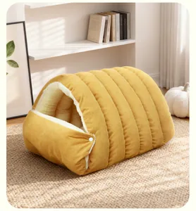 Detailed side view of yellow corduroy semi-enclosed pet bed in a cozy home setting decor