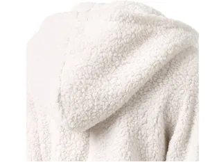 Detailed macro view showing the soft white fleece texture of a cozy hooded jacket