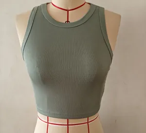 Close-up front view of a sage green ribbed sleeveless crop top on a display mannequin