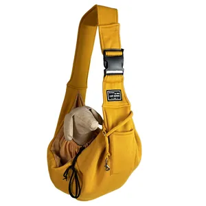 Detailed view of breathable yellow pet sling carrier bag with adjustable shoulder strap