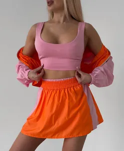 Women's pink and orange color-block 3-piece leisure set with zip jacket and skirt