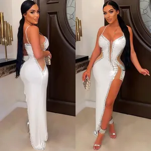 Elegant white evening gown featuring sparkling rhinestones sheer mesh panels and a high leg slit