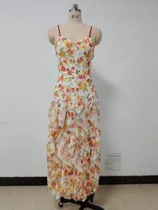 Detailed view of the elegant floral print chiffon dress with tiered ruffled layers.