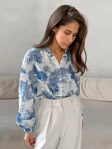 Chic women's stand collar shirt featuring blue landscape print and lantern sleeves