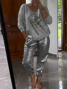 Metallic silver two-piece set for women with long sleeve sequin eye top and joggers