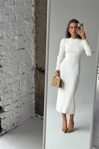 Elegant white ribbed long-sleeve knit midi dress presented in a stylish mirror selfie style