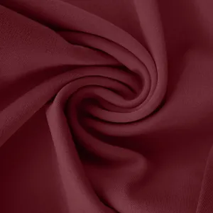 Macro detail of burgundy high-density fabric showing soft texture and fine weave