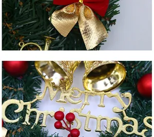 Macro detail of Christmas wreath with golden Merry Christmas sign and red berries