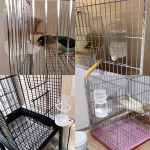 Detailansicht der automatischen Vogeltränke installiert in verschiedenen Käfigen.