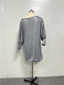 Silver sequined cocktail dress with slanted shoulder design on a mannequin