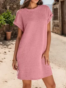 Casual pink crew neck short sleeve dress with textured fabric and rolled cuffs