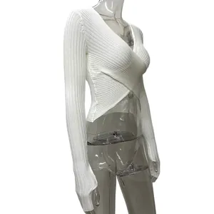 Side view detail of sexy white ribbed knit crossover long sleeve crop top for women
