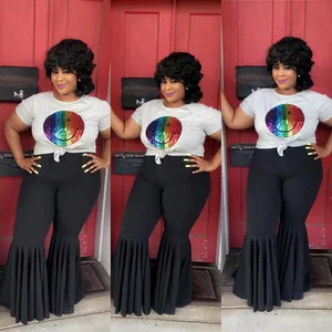 Fashionable women's black flared bell-bottom pants with ruffled hem and rainbow sequin top