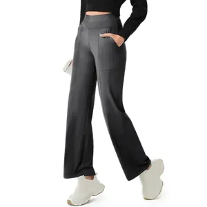 Detailed view of high-waisted grey yoga pants featuring a wide-leg cut and side pocket.