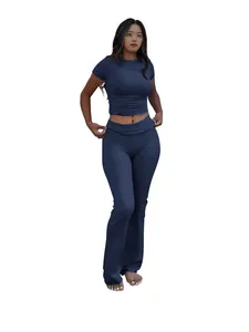 Navy blue two-piece sportswear set featuring a crew neck tee and low-waist flare pants