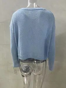 Back view of a light blue long-sleeve knitted cardigan sweater on a mannequin.