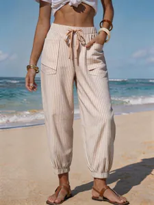Stylish striped summer jogger pants for women featuring a functional drawstring waist and pockets.