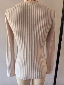 Close-up back view of a slim fit long-sleeve ribbed knit T-shirt for women in cream