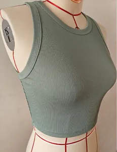 Detail of sage green ribbed sleeveless crop top on a professional tailor mannequin