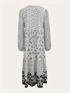 Back view of a graceful long-sleeved maxi dress featuring monochrome floral prints