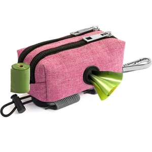 Detailed macro view of a pink pet waste bag dispenser with green biodegradable waste bags.