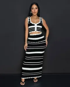 Full-length view of black and white striped knit crop top and high-waisted maxi skirt set