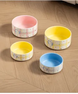 Detailed arrangement of Piano Rabbit ceramic pet bowls featuring pastel colors and plaid patterns