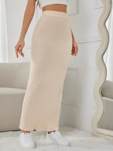 Close-up of an elegant apricot ribbed high waist bodycon maxi skirt for a chic look