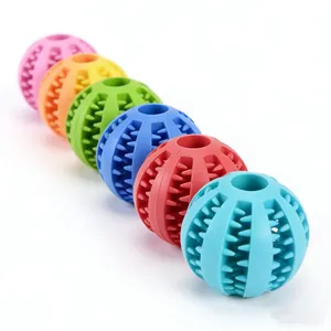 Collection of six colorful TPR spiky dog toy balls for dental cleaning and treat dispensing