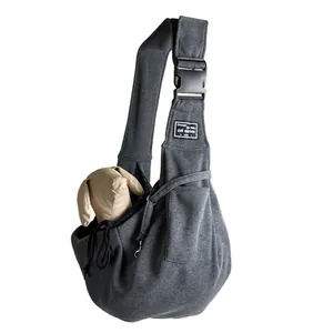 Close-up of a grey breathable pet sling carrier bag with adjustable strap and pocket