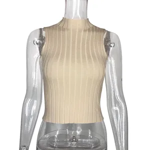 Close-up view of beige ribbed sleeveless knit top with mock neck and slim fit design.