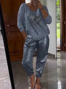 Casual women's 2-piece set with long-sleeve metallic eye print top and matching pants