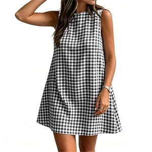Detail view of a black and white gingham sleeveless dress styled with casual jewelry