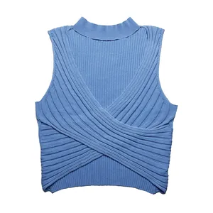 Detailed texture of this blue ribbed knit tank top featuring a crossover front design
