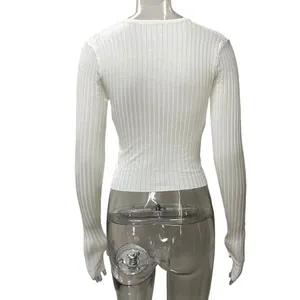 Back view of white long sleeve ribbed knit cropped top showing texture and slim fit design