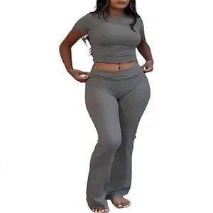 Women's two-piece workout set with crew neck crop top and low waist flare pants