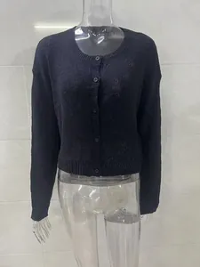 Women's black long sleeve knitted cardigan with round neck and buttons detail view
