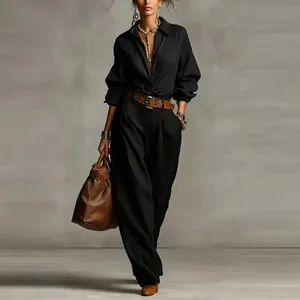 Full view of women's black long-sleeved shirt and wide-leg trousers set with accessories