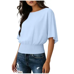 Detailed view of women's light blue casual top with smocked waist and loose sleeves