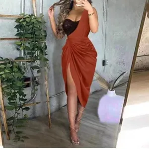 Elegant orange one-shoulder evening dress with black sequin bodice and high side slit